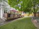 Spacious backyard with a lush lawn and a deck with outdoor seating at 6432 S Robb Ct, Littleton, CO 80127