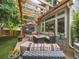 Backyard patio with a pergola, outdoor seating, and a fire pit table at 6432 S Robb Ct, Littleton, CO 80127