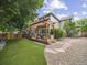 Backyard with artificial turf, gravel area, and a patio with pergola at 6432 S Robb Ct, Littleton, CO 80127
