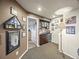 Basement includes a wet bar with beautiful cabinetry, storage, and mini fridge at 6432 S Robb Ct, Littleton, CO 80127