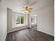 A peaceful bedroom retreat bathed in natural light with a large window and closet at 6432 S Robb Ct, Littleton, CO 80127