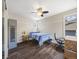 Inviting bedroom offers ample space and natural light at 6432 S Robb Ct, Littleton, CO 80127