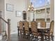 Formal dining room showcasing a large window and elegant chandelier fixture at 6432 S Robb Ct, Littleton, CO 80127
