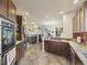 Modern kitchen with stainless steel appliances and granite countertops at 6432 S Robb Ct, Littleton, CO 80127