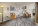 Beautiful living area featuring hardwood floors, a staircase, and access to the dining room at 6432 S Robb Ct, Littleton, CO 80127