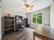 Inviting office space with desk, shelving, and natural light from large window at 6432 S Robb Ct, Littleton, CO 80127