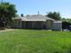 Spacious backyard with lush lawn and covered patio, great for outdoor entertaining and relaxation at 1271 Xapary St, Aurora, CO 80011