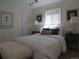 Bright bedroom featuring neutral walls, soft lighting, and a comfortable bed dressed in white linens at 1271 Xapary St, Aurora, CO 80011