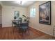 Chic dining area with modern table, chairs, wood floor, and natural light at 1271 Xapary St, Aurora, CO 80011