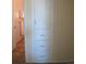 Hallway with built-in storage, showcasing smart use of space and convenient access to other rooms at 1271 Xapary St, Aurora, CO 80011