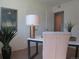 Comfortable home office featuring a desk, chair, ample light and a decorative plant adding a touch of nature at 1271 Xapary St, Aurora, CO 80011