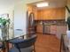 Contemporary kitchen with stainless steel appliances, light wood cabinets, and modern finishes at 1271 Xapary St, Aurora, CO 80011