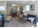Inviting living room with neutral walls, sleek furniture and ample natural light at 1271 Xapary St, Aurora, CO 80011