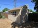 A nice storage shed with a window and double door in the backyard at 1271 Xapary St, Aurora, CO 80011