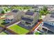 The back of the house has solar panels, a covered patio, and a fenced yard with grass at 14912 Vienna Cir, Parker, CO 80134