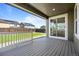Cozy back porch with sliding glass door, overlooking the backyard and adjacent houses at 14912 Vienna Cir, Parker, CO 80134
