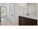 Bathroom featuring a vanity and view into the bathroom with a tiled shower-tub combo at 14912 Vienna Cir, Parker, CO 80134