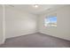 Bedroom featuring neutral walls, carpeted floors, and a window at 14912 Vienna Cir, Parker, CO 80134