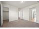 Spacious bedroom featuring neutral carpet, walk-in closet, and ample natural light at 14912 Vienna Cir, Parker, CO 80134
