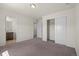 Bedroom featuring neutral walls, carpeted floors, a closet, and an ensuite bathroom at 14912 Vienna Cir, Parker, CO 80134