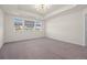 Spacious main bedroom with tray ceiling, neutral carpet, and plenty of natural light at 14912 Vienna Cir, Parker, CO 80134