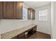 Office space with granite countertop desk and wooden cabinets at 14912 Vienna Cir, Parker, CO 80134