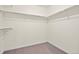Spacious walk-in closet featuring ample shelving and carpeted floors at 14912 Vienna Cir, Parker, CO 80134