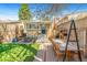 Backyard featuring a patio area with furniture, a grill, and an outdoor dining set under mature tree at 3109 N Williams St, Denver, CO 80205