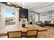Bright dining room featuring a large window and a rustic wooden table at 3109 N Williams St, Denver, CO 80205