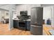 Modern kitchen with stainless steel appliances, stylish backsplash, and open floor plan at 3109 N Williams St, Denver, CO 80205
