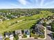 Wide aerial view of a neighborhood with walking paths and a green space at 3543 Foxridge Trl, Highlands Ranch, CO 80126