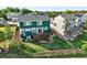 Gorgeous two-story home with a spacious backyard, lush lawn and wooden deck at 3543 Foxridge Trl, Highlands Ranch, CO 80126