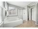 Bright bathroom with soaking tub, glass enclosed shower, and tile flooring at 3543 Foxridge Trl, Highlands Ranch, CO 80126