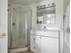 Clean bathroom featuring a glass shower and white vanity with modern fixtures and hardware at 3543 Foxridge Trl, Highlands Ranch, CO 80126