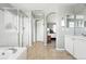 Bathroom view with tile flooring, soaking tub, and glass shower at 3543 Foxridge Trl, Highlands Ranch, CO 80126