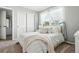 Bright bedroom with lots of natural light, closet and an ensuite bathroom at 3543 Foxridge Trl, Highlands Ranch, CO 80126