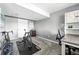 Versatile bedroom is set up as an exercise room and office space with ample natural light at 3543 Foxridge Trl, Highlands Ranch, CO 80126