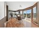 Dining area with a table, chairs, sliding doors to the outdoor deck, and open to the kitchen at 3543 Foxridge Trl, Highlands Ranch, CO 80126