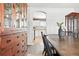 Dining room showcases a built-in cabinet, table, and arched doorway to the kitchen at 3543 Foxridge Trl, Highlands Ranch, CO 80126