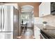 Cozy kitchen boasts stainless steel appliances and granite countertops, flowing into a dining area at 3543 Foxridge Trl, Highlands Ranch, CO 80126