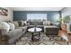 Comfortable living room featuring a large sectional sofa and a patterned area rug at 3543 Foxridge Trl, Highlands Ranch, CO 80126