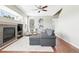 Living room with hardwood floors, a fireplace, and a comfortable gray sofa at 3543 Foxridge Trl, Highlands Ranch, CO 80126