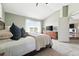 Main bedroom features a vaulted ceiling, a dresser, a large window, and an ensuite bath at 3543 Foxridge Trl, Highlands Ranch, CO 80126