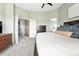 Bright main bedroom boasts high ceilings, ceiling fan and ensuite bathroom access at 3543 Foxridge Trl, Highlands Ranch, CO 80126