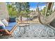 Relaxing balcony featuring a comfortable bench, hammock, and patterned rug with scenic views at 5300 E Cherry Creek South Dr # 124, Denver, CO 80246