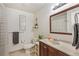 Cozy bathroom with vanity, tile flooring, and a shower-tub combination with decorative accents at 5300 E Cherry Creek South Dr # 124, Denver, CO 80246