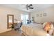 Well-lit bedroom featuring a ceiling fan, ample natural light, and a comfortable bed at 5300 E Cherry Creek South Dr # 124, Denver, CO 80246