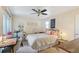 Comfortable bedroom with ceiling fan, cozy furnishings, and natural light from the window at 5300 E Cherry Creek South Dr # 124, Denver, CO 80246