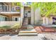 Townhome exterior features stairs leading to the front door and upper level decks at 5300 E Cherry Creek South Dr # 124, Denver, CO 80246