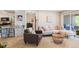 Cozy living room with an open floor plan featuring plush seating and a sliding glass door at 5300 E Cherry Creek South Dr # 124, Denver, CO 80246